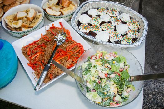 Party table arrangement with assortment of foods.