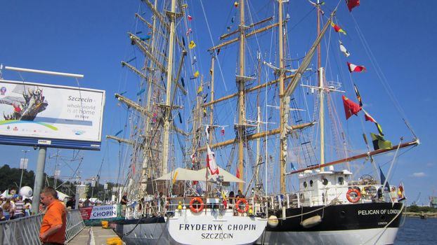 Sailing ships with lowered sails docked in Szczecin, Poland. The Tall Ship Races 2013