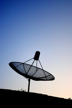 Satellite dish silhouette with blue sky background
	
