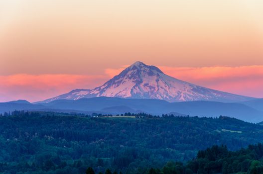 Mount Hood looking purple as the sun sets in the Pacific Northwest