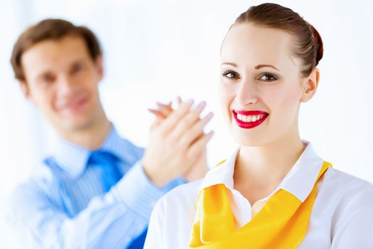 Image of businessman and businesswoman smiling joyfully