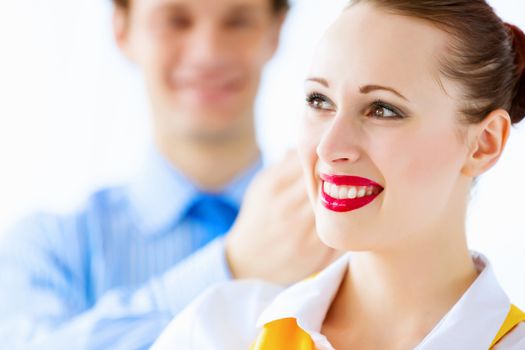 Image of businessman and businesswoman smiling joyfully