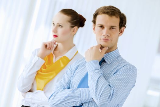 Image of businessman and businesswoman smiling joyfully