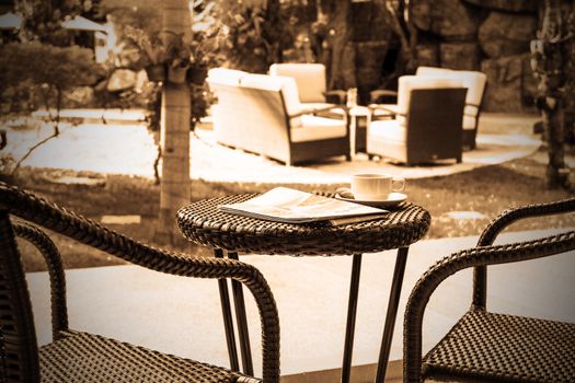 Coffee and newspaper on table for relax