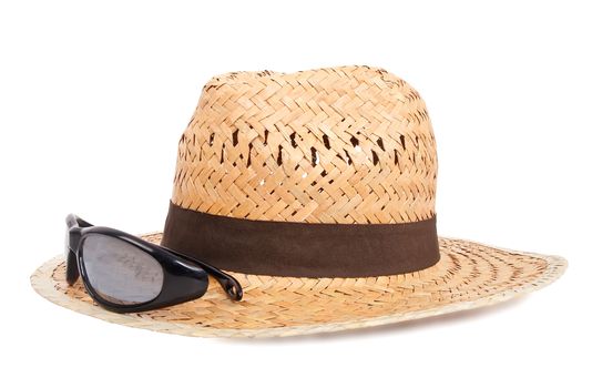 woven hat and sun glasses on white background