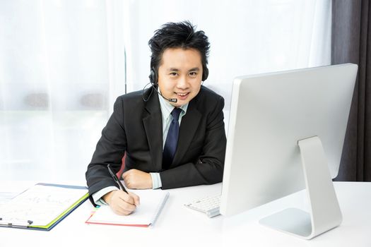businessman making tele conference with desktop computer