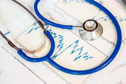 stethoscope with financial graph for business insurance concept