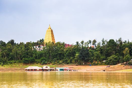 Golden sanctuary pagoda at sangklaburi, thailand