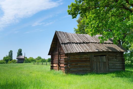 Typical traditional square village antique wooden storehouse or shed with wooden roof