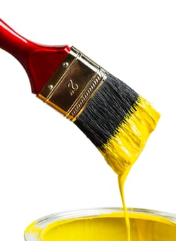 paintbrush with yellow paint isolated on white background