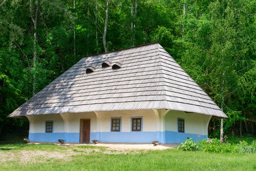 Typical village house in Ukrainian countryside with gardens around