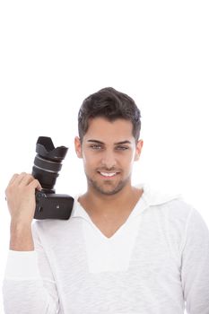 Handsome ushaven professional male photographer with his dslr camera in his hand resting on his shoulder smiling at the camera, isolated on white