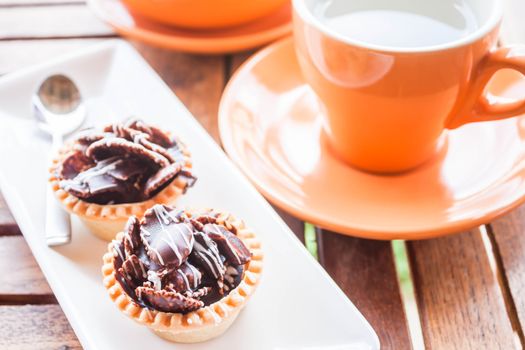 Hot tea and crispy chocolate tarts, stock photo