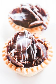 Crispy chocolate tarts isolated on white background, stock photo