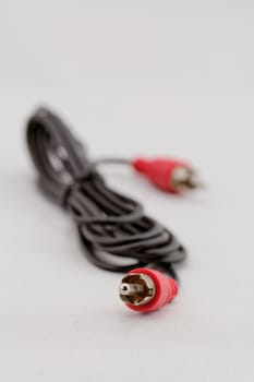 only red audio RCA cable on a white background (left)