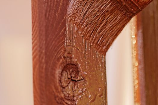 planks fence dyeing with brown paint and brush