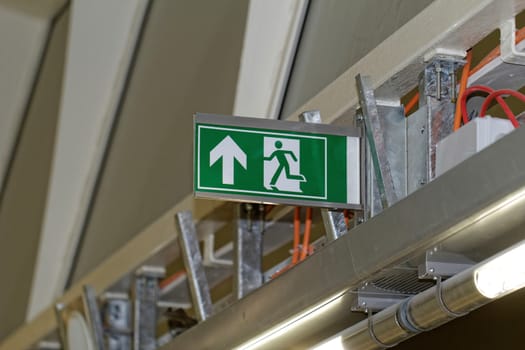 Emergency exit sign in construction site an industrial plant