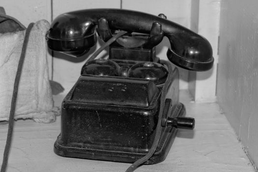Old black phone with roll (from II world war, antique) bw
