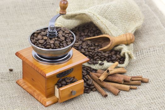 cinnamon sticks, coffee beans and coffee grinder 