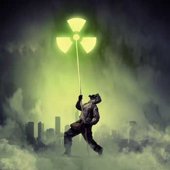 Man in respirator against nuclear background. Radioactivity concept