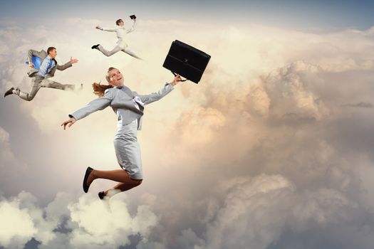 Image of businesspeople jumping high in sky