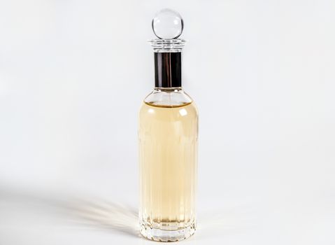 Bottle of female perfume on isolated background