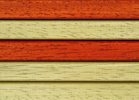 background with laths of hardwood orange and reddish brown