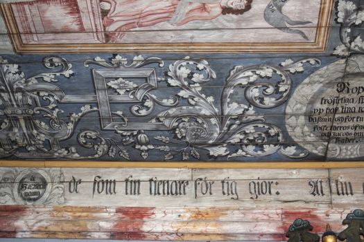 Detail of ceiling paintings of an old wooden medieval church in Algaras, Sweden, built in the 12th century