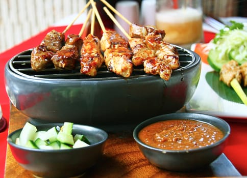 Grilled chicken and beef satays in a restaurant in Bali, Indonesia. Fish Satey Lilit is one of the most popular dishes in Bali.