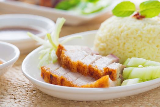 Siu Yuk or crispy roasted belly pork Chinese style, served with steamed rice. Singapore Chinese cuisines.