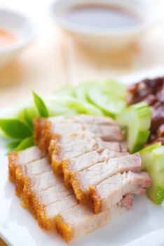 Siu Yuk or crispy roasted belly pork Chinese style and roast duck, served with steamed rice. Malaysia Chinese cuisines.
