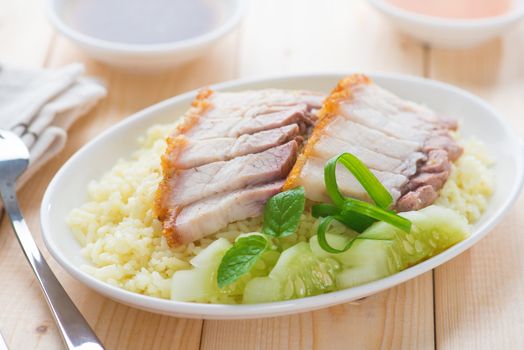 Siu Yuk or sliced Chinese boneless roast pork with crispy skin, serve with steamed rice. Hong Kong Chinese cuisine.