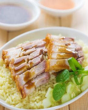 Siu Yuk or sliced Chinese boneless roast pork with crispy skin, serve with steamed rice. Singapore Chinese cuisine.