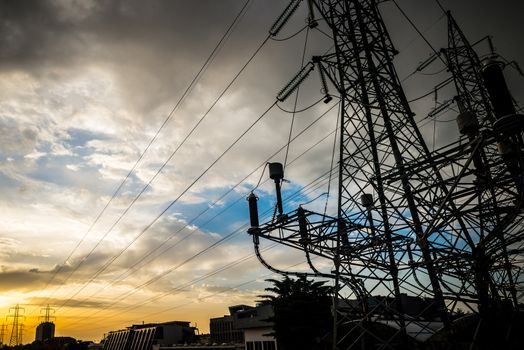 electricity poles in the city on sunrise