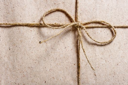 parcel wrapped in brown paper and tied with twine