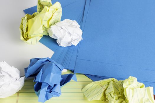 Different styles of paper scattered and crumbled.