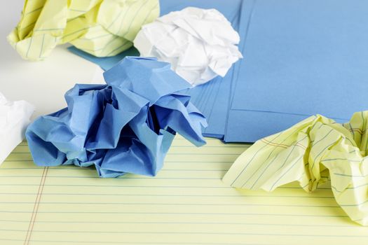 Different styles of paper scattered and crumbled.