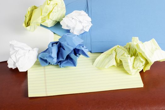 Different styles of paper scattered and crumbled.