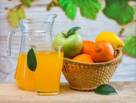 orange juice in a glass on a table with oranges