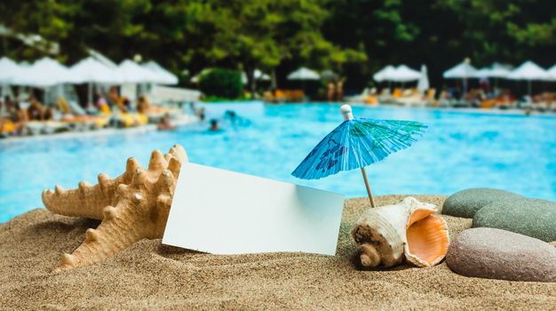 Umbrella on the sand on the background of the beach