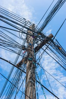 Intertwining of many electrical wires on poles