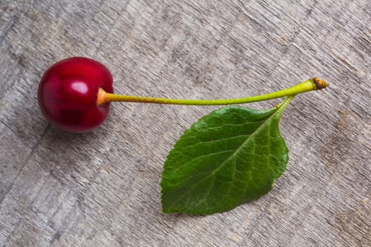 fresh cherries on wooden table