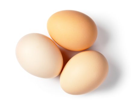 Three eggs on white background. Top view