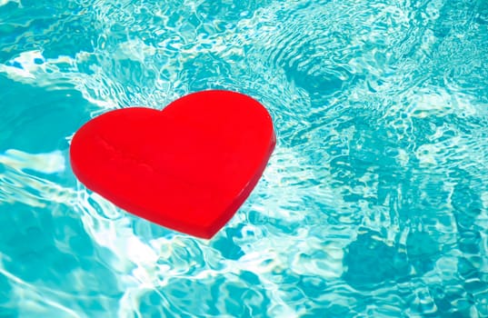 Heart shape in swimming pool - holiday concept