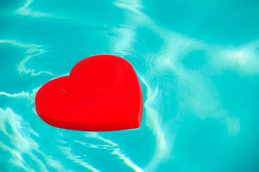 Heart shape in swimming pool - holiday concept