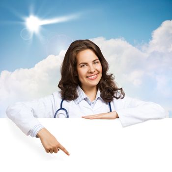 Young attractive female doctor put her hands on the blank banner, place for text