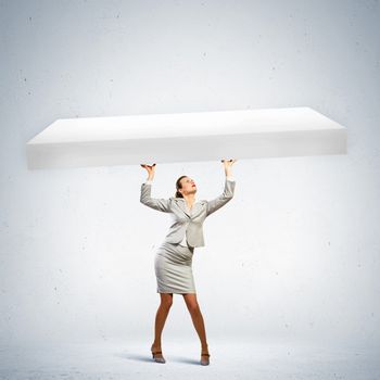 Businesswoman holding blank banner above head. Place for text