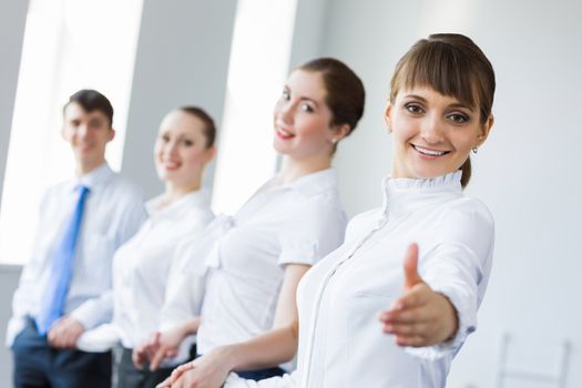 Image of four businesspeople standing in row. Partnership concept