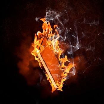 Image of burning book against black background