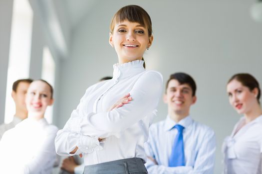 Young business people standing with arms crossed on chest